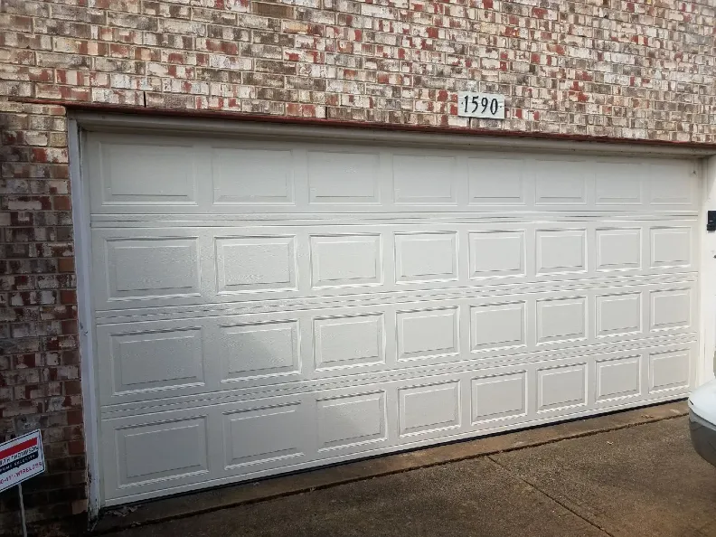 White garage door with a raised panel design